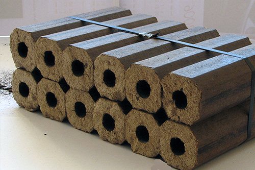 Fired hexagonal wood briquettes with a hole in the center. They are compact for storage and are great for heating a stove or fireplace, or even a boiler. 