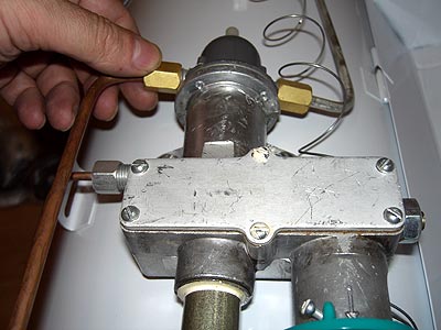 A specialist repairs a thermocouple