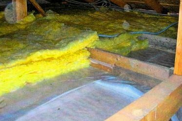 Mineral wool is laid on a vapor barrier