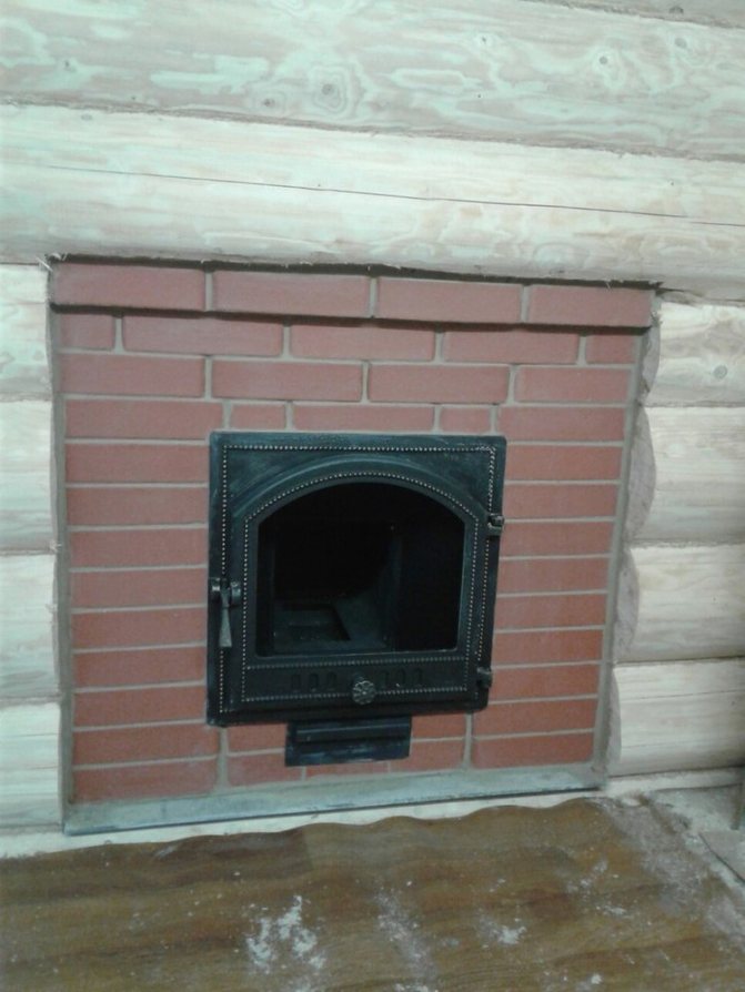 installation of a sauna stove with a remote firebox