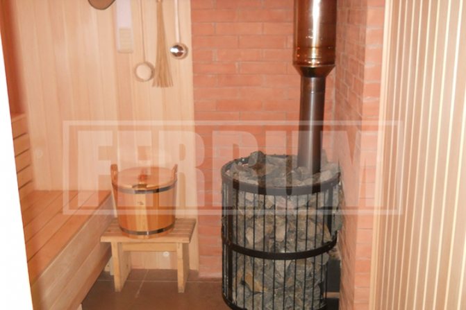 installation of an iron stove in a wooden bathhouse